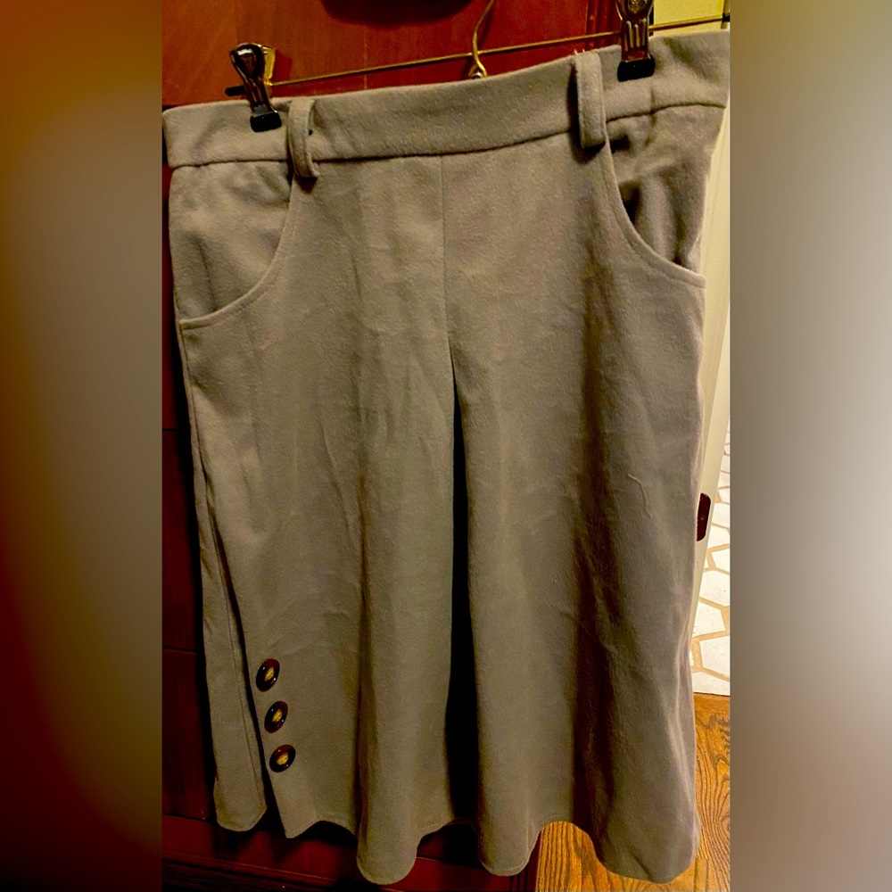 Gray flannel skirt. A-line. Runs small.